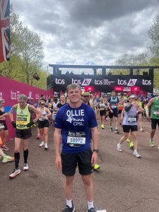 Man at running event with group of people