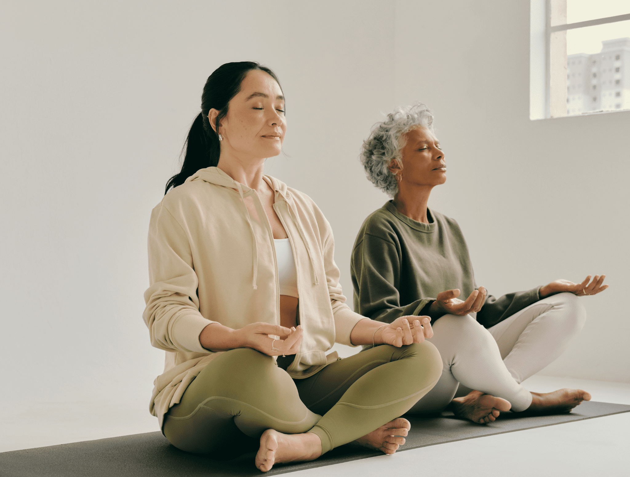 Two women meditating