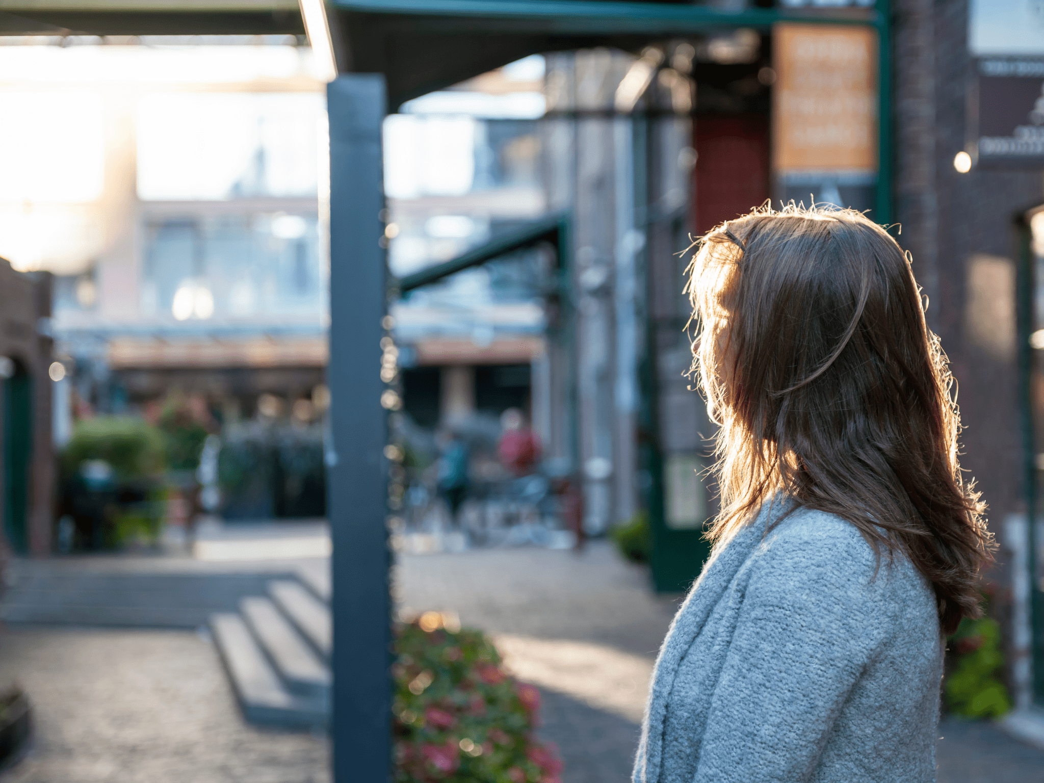 Woman with brown hair looking away